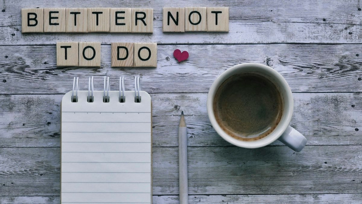 Scrabble message "better not to do" with coffee and stationery